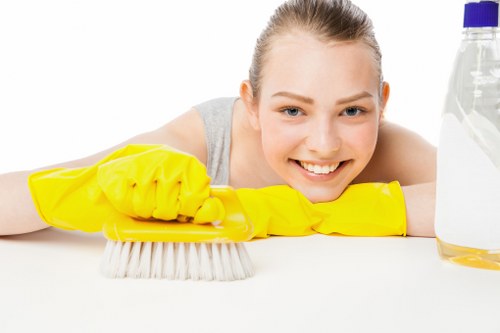 Staff member reviewing workplace safety procedures before cleaning