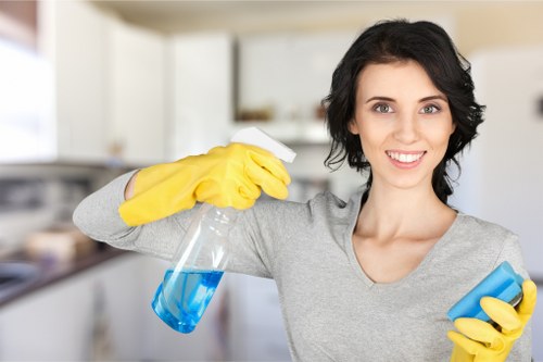Carpet cleaning professional using protective equipment in a SW17 property