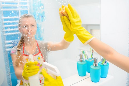Local cleaner carrying out a detailed kitchen clean in SW17