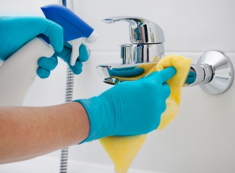 Local cleaner preparing a kitchen for end of tenancy handover in SW17