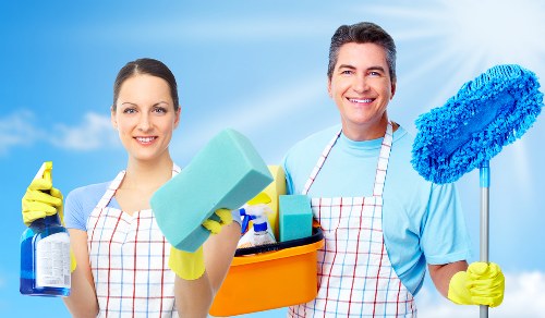 Local after builders cleaning team tidying a renovated room in SW17